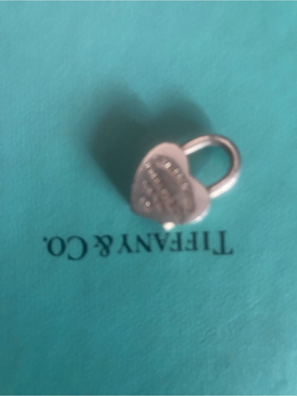 Tiffany & Co. Sterling Silver Heart Padlock Charm on Blue